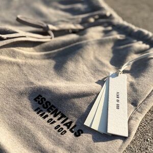 Fear of God Essentials Light Gray shorts with Black Logo